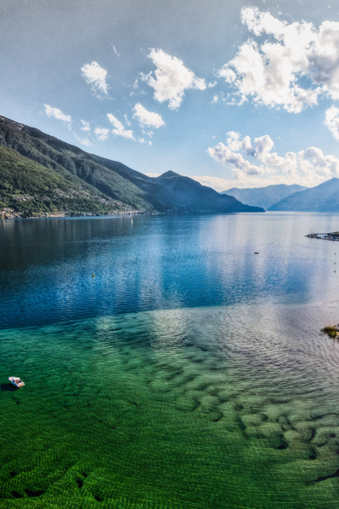 Clear lake with mountains in the background