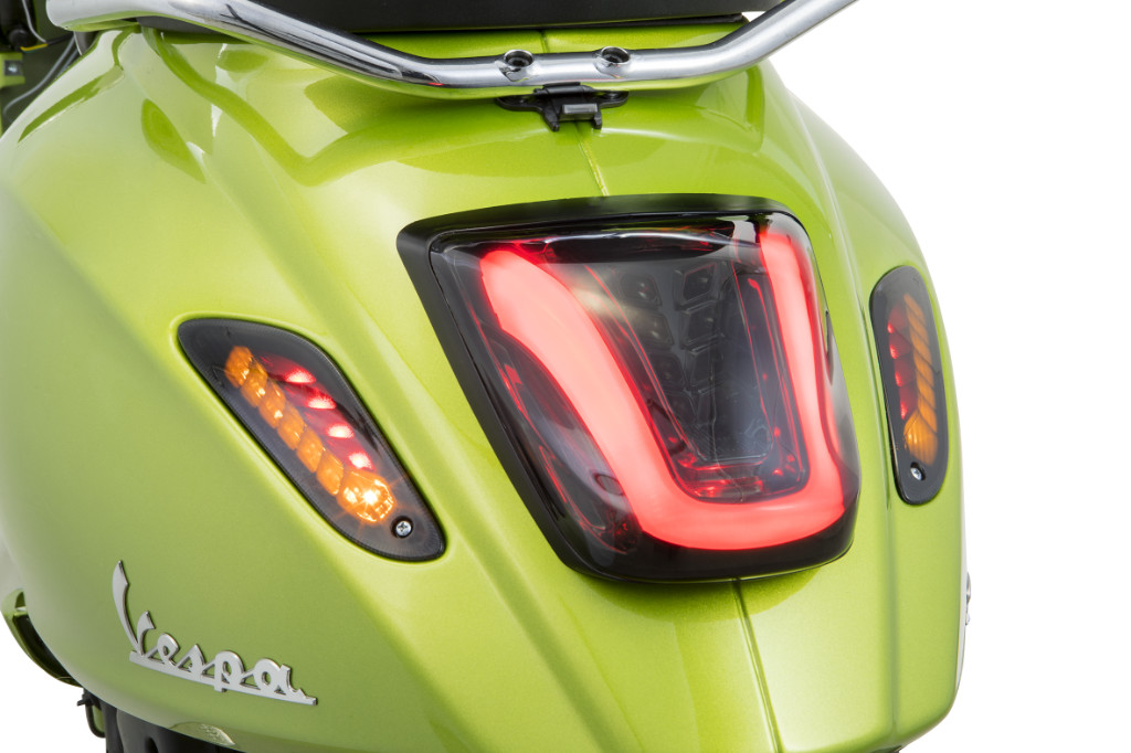 Close-up of a green Vespa tail light
