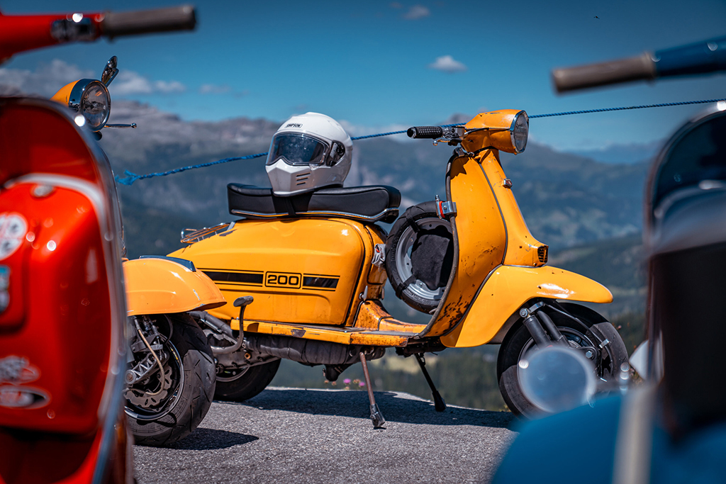 Yellow standing Vespa